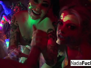 Black-Light Babes Nadia White And Ophelia Suck Off A Colorful Cock